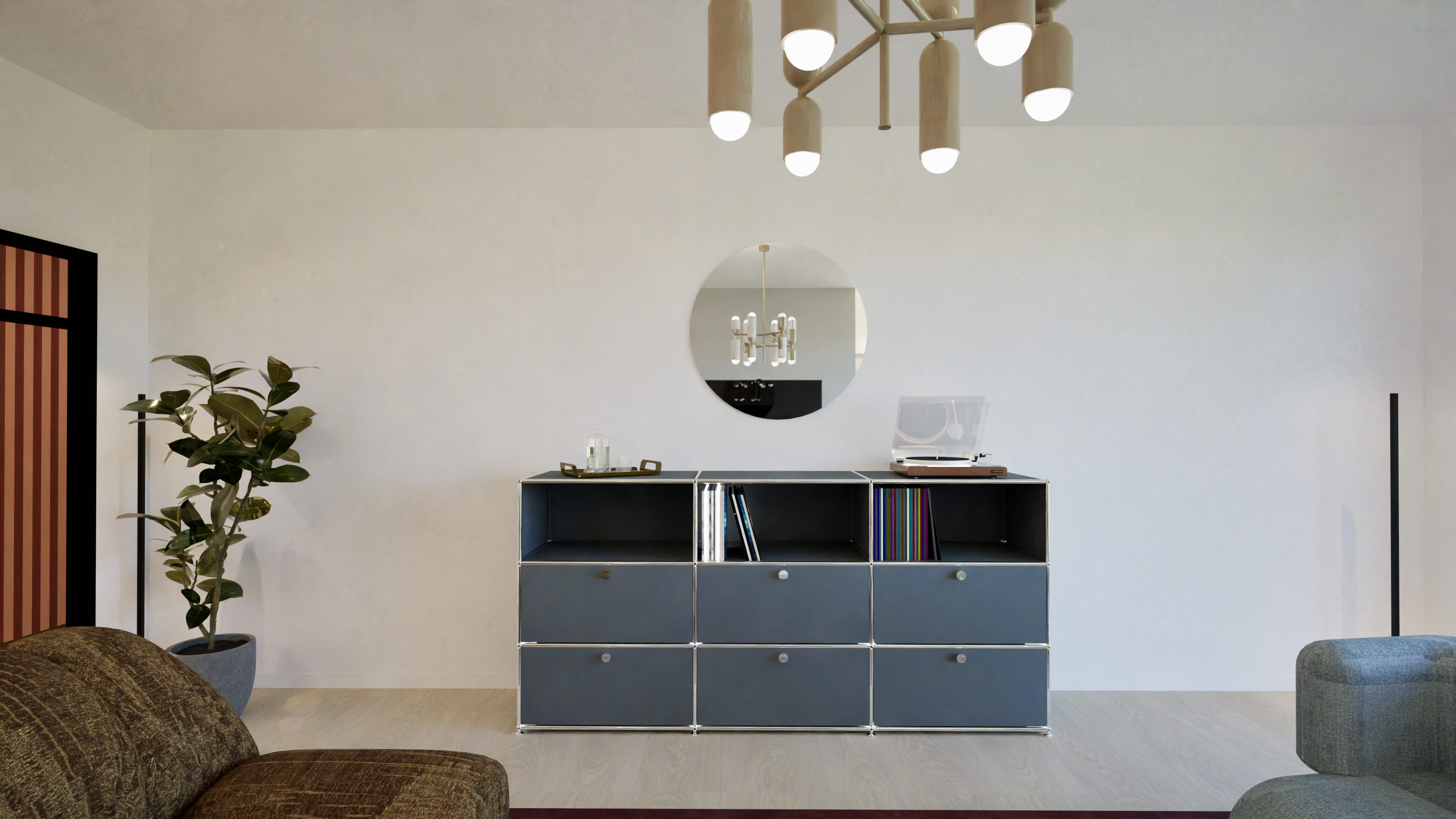 Salon design avec meuble USM gris, miroir rond, agencement sur‑mesure et palette ocre‑bordeaux‑bleu — Projet Lorrier, architecture d’intérieur Rennes